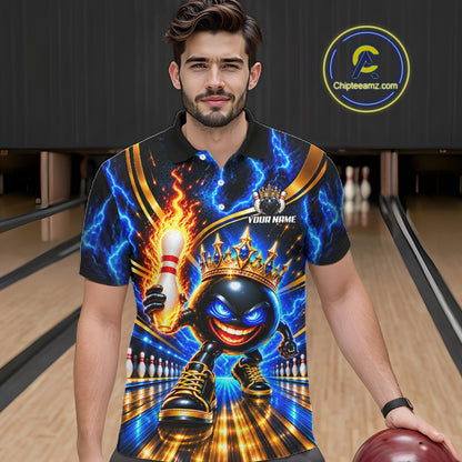 A man wearing a custom short-sleeve polo shirt with a vibrant bowling-themed graphic print, standing in a bowling alley. The shirt features a cartoon bowling ball wearing a crown, lightning bolts, and a flaming pin.