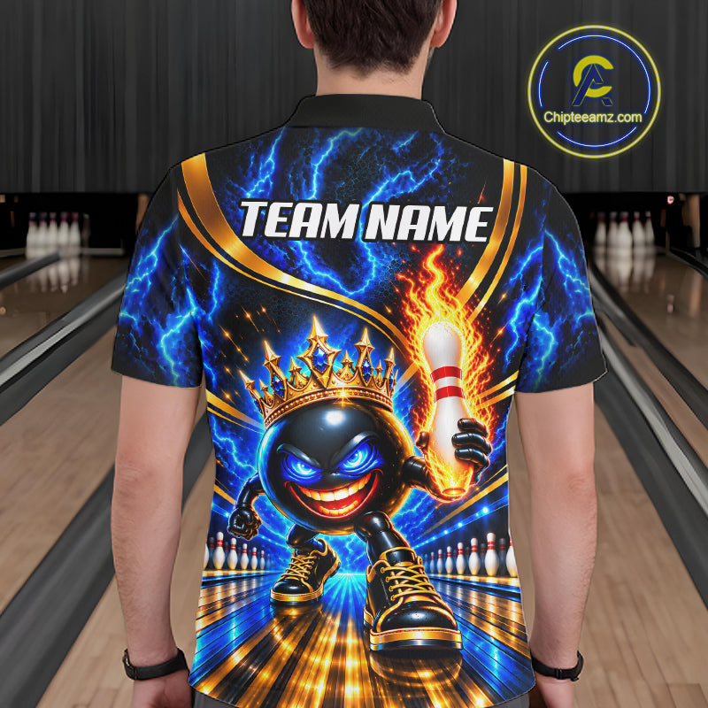 A man wearing a custom short-sleeve polo shirt with a vibrant bowling-themed graphic print, standing in a bowling alley. The shirt features a cartoon bowling ball wearing a crown, lightning bolts, and a flaming pin.