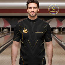 Load image into Gallery viewer, Men wearing personalized bowling quarter zip shirt with a crowned bowling ball accent paired with gold line patterns across a black layout.