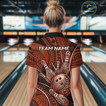 Load image into Gallery viewer, Women wearing personalized bowling quarter zip shirt with bowling balls and pins arranged within orange polynesian tribal patterned artwork across a dark layout.