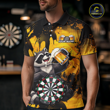 Load image into Gallery viewer, Person wearing a black and yellow darts polo featuring a raccoon drinking beer, dartboard graphics, and custom team and player name text.