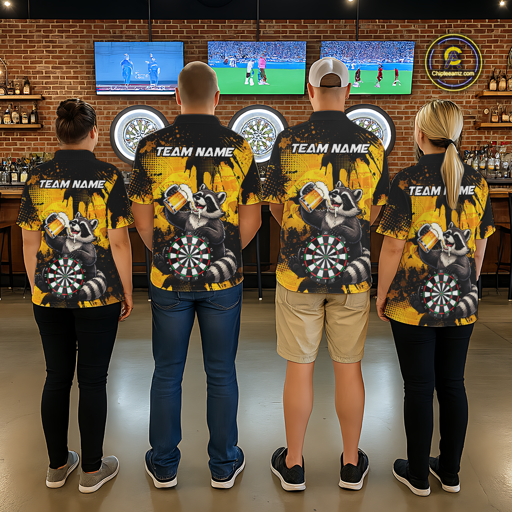 Four people wearing black and yellow darts polo featuring a raccoon drinking beer, dartboard graphics, and custom team and player name text.