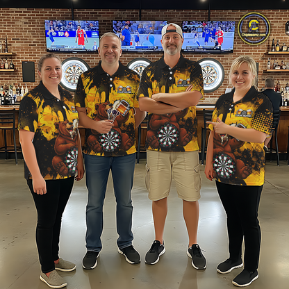 Four people wearing black and yellow darts polo featuring a bear drinking beer, dartboard graphics, and custom team and player name text.