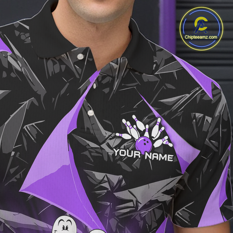 A close-up of a person wearing a black short-sleeve polo shirt with a purple and gray bowling-themed graphic print, featuring a bowling pin and ball design with the text 'YOUR NAME' on the chest.
