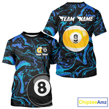 Load image into Gallery viewer, Two t-shirts with pool ball designs and 'Team Name' text on a white background.