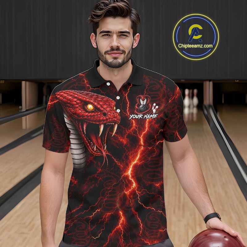 A man wearing a black short-sleeve polo shirt with a red and black snake and lightning graphic, standing in a bowling alley. A circular 'Chipteeamz.
