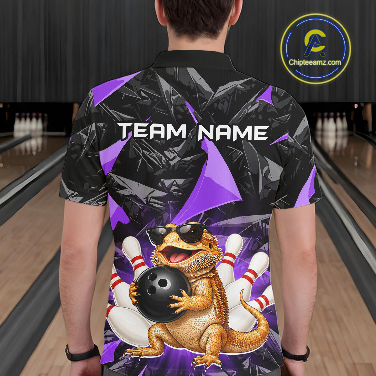 Men’s purple bearded dragon bowling polo shirt, back view on male model in bowling lane 
