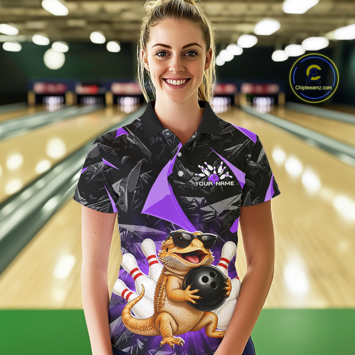 Women’s purple bearded dragon bowling polo shirt, front view on female model in bowling lane 