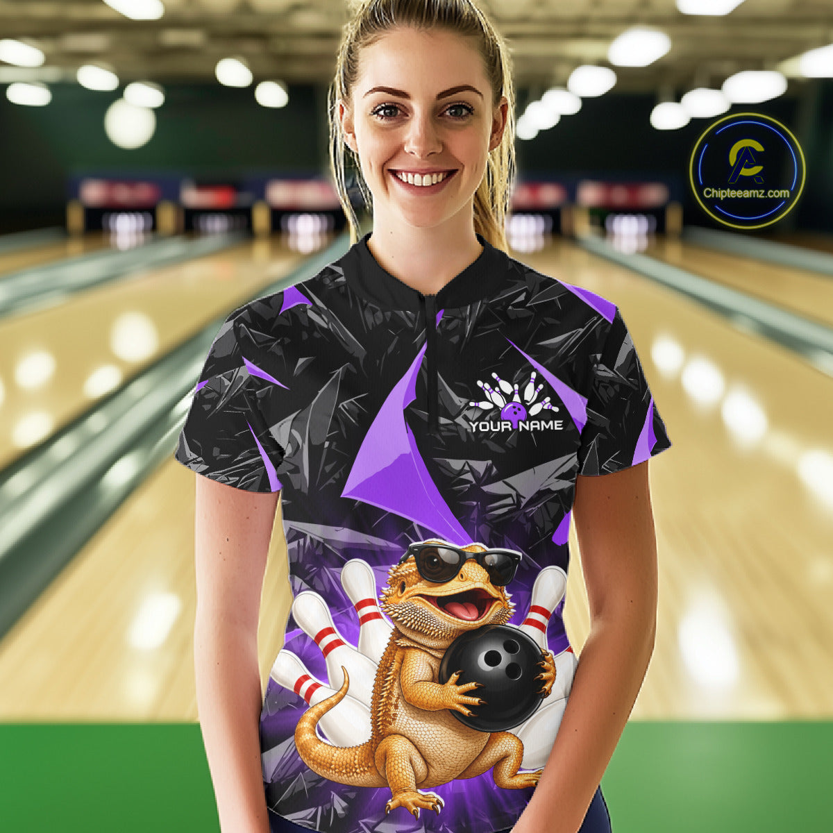 Women’s purple bearded dragon bowling quarter zip shirt, front view on female model in bowling lane 