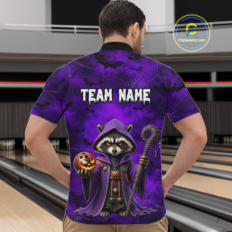 A man viewed from behind wearing a purple short-sleeve polo shirt with a large Halloween-themed raccoon graphic and the text 'TEAM NAME' on the back. The shirt has a black collar and is shown in a bowling alley setting.