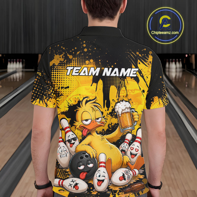 A person viewed from behind wearing a black and yellow bowling-themed short-sleeve shirt with a cartoon duck holding a beer mug and the text 'TEAM NAME' on the back. Bowling lanes are visible in the background, and a circular 'Chipteeamz.