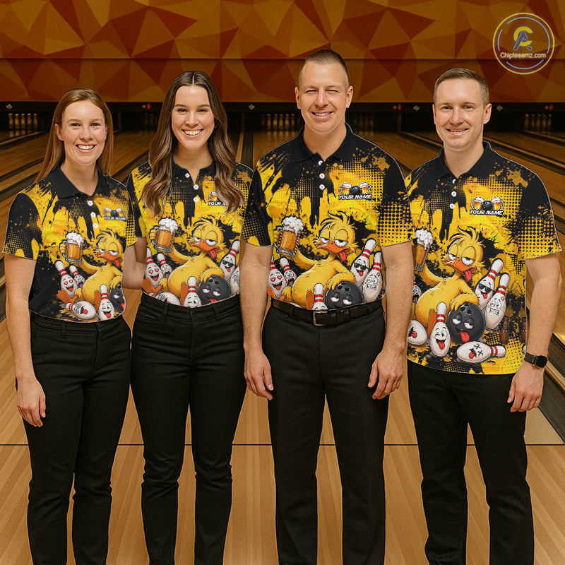 Four people standing in a bowling alley wearing matching bowling shirts with a cartoon bear and bowling pin graphic, paired with black pants. 