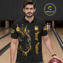 Load image into Gallery viewer, Man wearing a black polo shirt with a gold and black panther design and 'Your Name' text, holding a bowling ball in a bowling alley.