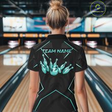Load image into Gallery viewer, Person wearing a black bowling shirt with teal graphics and 'TEAM NAME' text in a bowling alley.