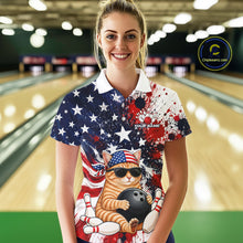 Load image into Gallery viewer, Woman wearing a colorful bowling shirt with a cat design in a bowling alley.