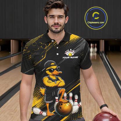 Man wearing a black and yellow bowling shirt with a duck design in a bowling alley.
