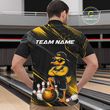 Load image into Gallery viewer, Person wearing a black and yellow bowling shirt with a cartoon duck character on a bowling alley.