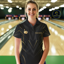Load image into Gallery viewer, Woman wearing a black bowling shirt with gold accents in a bowling alley.