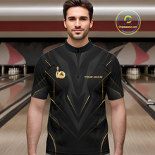 Load image into Gallery viewer, Man wearing a black bowling shirt with gold accents in a bowling alley.