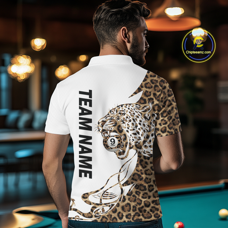 Man wearing a white polo shirt with a leopard design and 'Team Name' text, standing in a pool hall.
