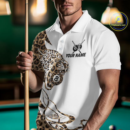 Man wearing a white polo shirt with leopard print and pool cue design, holding a pool cue on a billiards table.