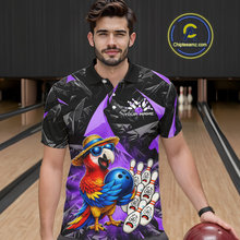 Load image into Gallery viewer, Man wearing a colorful bowling shirt with a parrot design in a bowling alley.