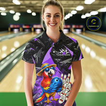 Load image into Gallery viewer, Woman wearing a bowling shirt with a parrot design in a bowling alley.