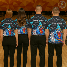 Load image into Gallery viewer, Four people wearing matching bowling shirts with colorful parrot designs on a bowling alley.