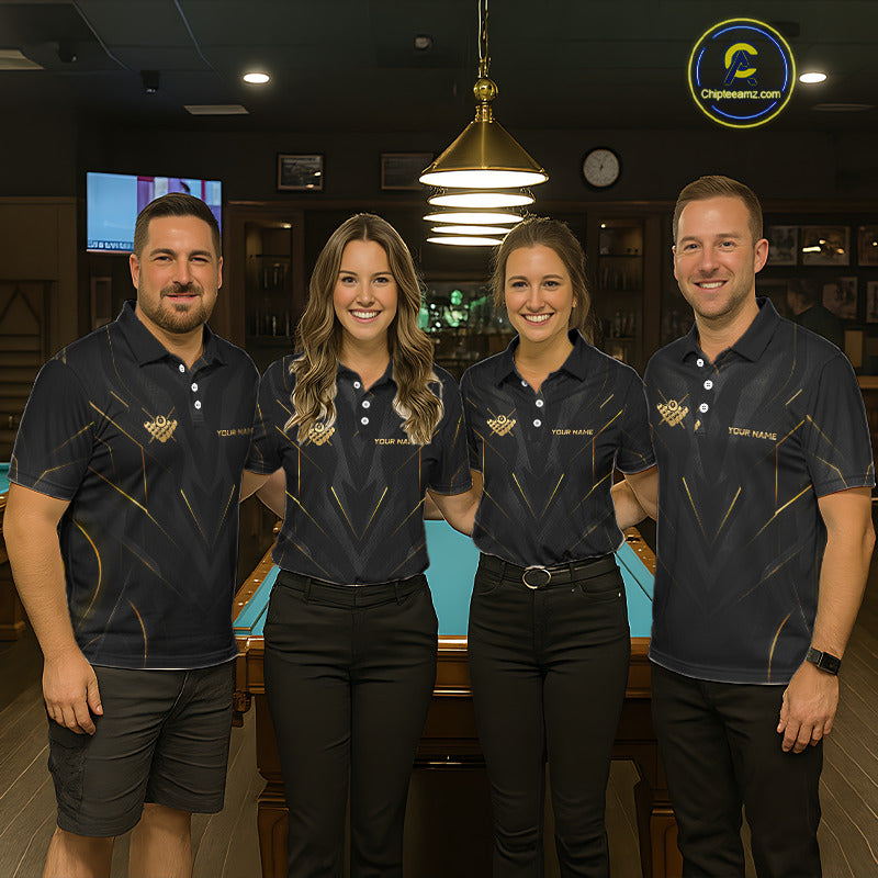 Four people in matching dark blue polo shirts with logos standing in a bar setting.