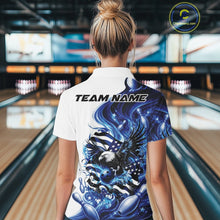 Load image into Gallery viewer, Back view female model in a bowling lane wearing a white and blue quarter zip shirt with eagle artwork and flowing American flag inspired accents.