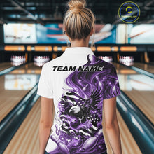 Load image into Gallery viewer, Female model back view at the bowling lane wearing a white and purple quarter zip shirt with eagle artwork and flowing flag inspired accents.