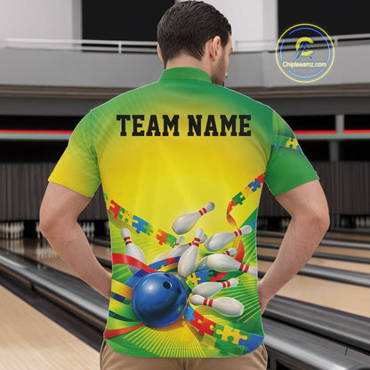 Male model in a bowling lane wearing a green and yellow quarter-zip shirt, puzzle bowling strike artwork with energetic autism-themed design.