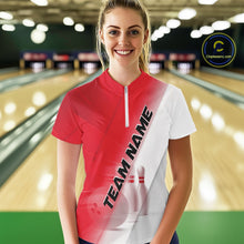 Load image into Gallery viewer, Female model front view at the bowling lane wearing a quarter zip shirt with bowling ball and pins in a red and white diagonal layout.