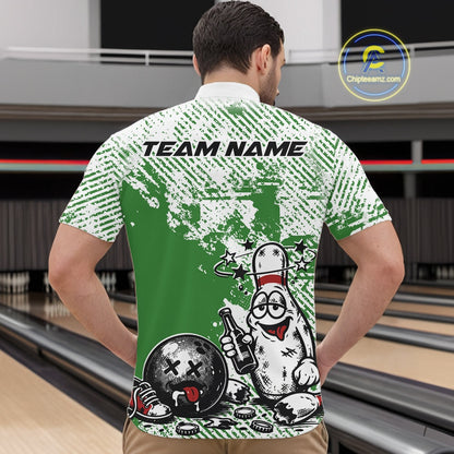 Male model at a bowling lane wearing a green and white quarter-zip shirt, cartoon drunk bowling pin with beer bottle and bowling ball graphic.