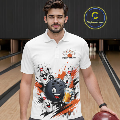 A man wearing a white short-sleeve polo shirt with a bowling-themed graphic print featuring a cartoon bowling ball, pins, and orange paint splatters. He is standing in a bowling alley holding a bowling ball