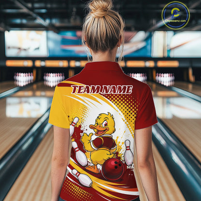A woman viewed from behind wearing a custom bowling polo shirt with a yellow duck graphic and 'TEAMNAME' text, set against a blurred bowling alley background.