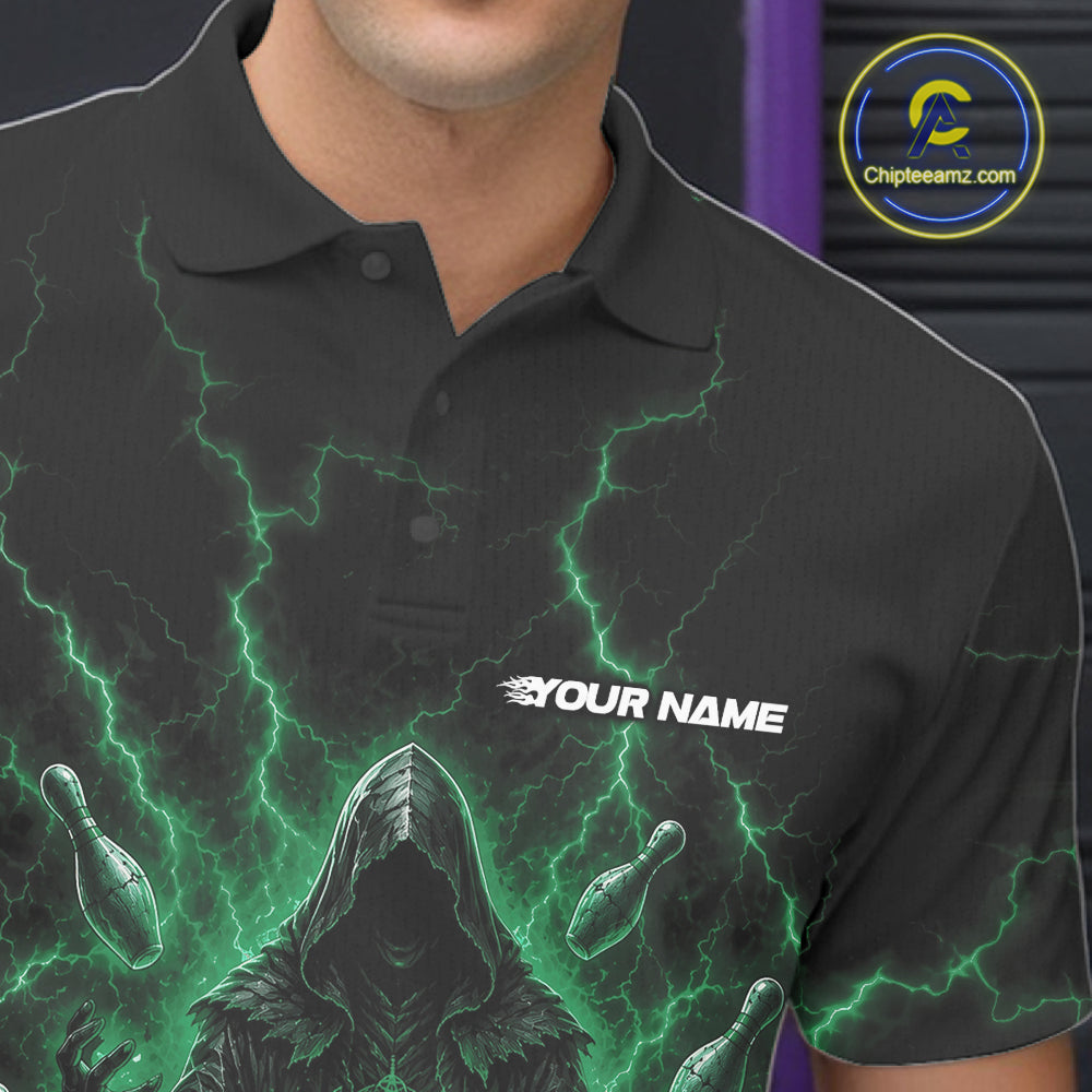 A close-up of a man wearing a black short-sleeve polo shirt with a green lightning and bowling pin graphic, featuring a white 'YOUR NAME' text print on the chest. 