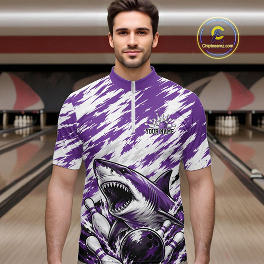 Man wearing a purple and white bowling shirt with shark design in a bowling alley.