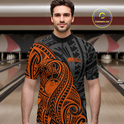 Man wearing a black and orange  bowling quarter zip shirt featuring tribal pattern bowling ball and pin graphics design