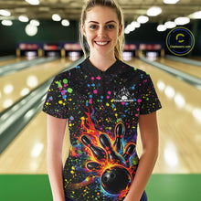 Load image into Gallery viewer, Female model wearing a black bowling quarter-zip shirt at the bowling lane with colorful paint splatters and bowling strike graphics.