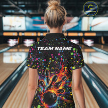 Load image into Gallery viewer, Back view of a female model in a black bowling quarter-zip shirt featuring vibrant music-inspired splatter bowling artwork.