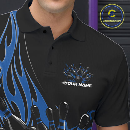 Close-up view of the left chest area of a black bowling polo shirt showing a blue flaming black bowling ball and pins design detail.