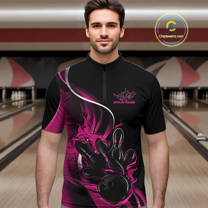 Male model front view in bowling alley wearing black and pink quarter zip shirt featuring flame bowling strike themed graphics
