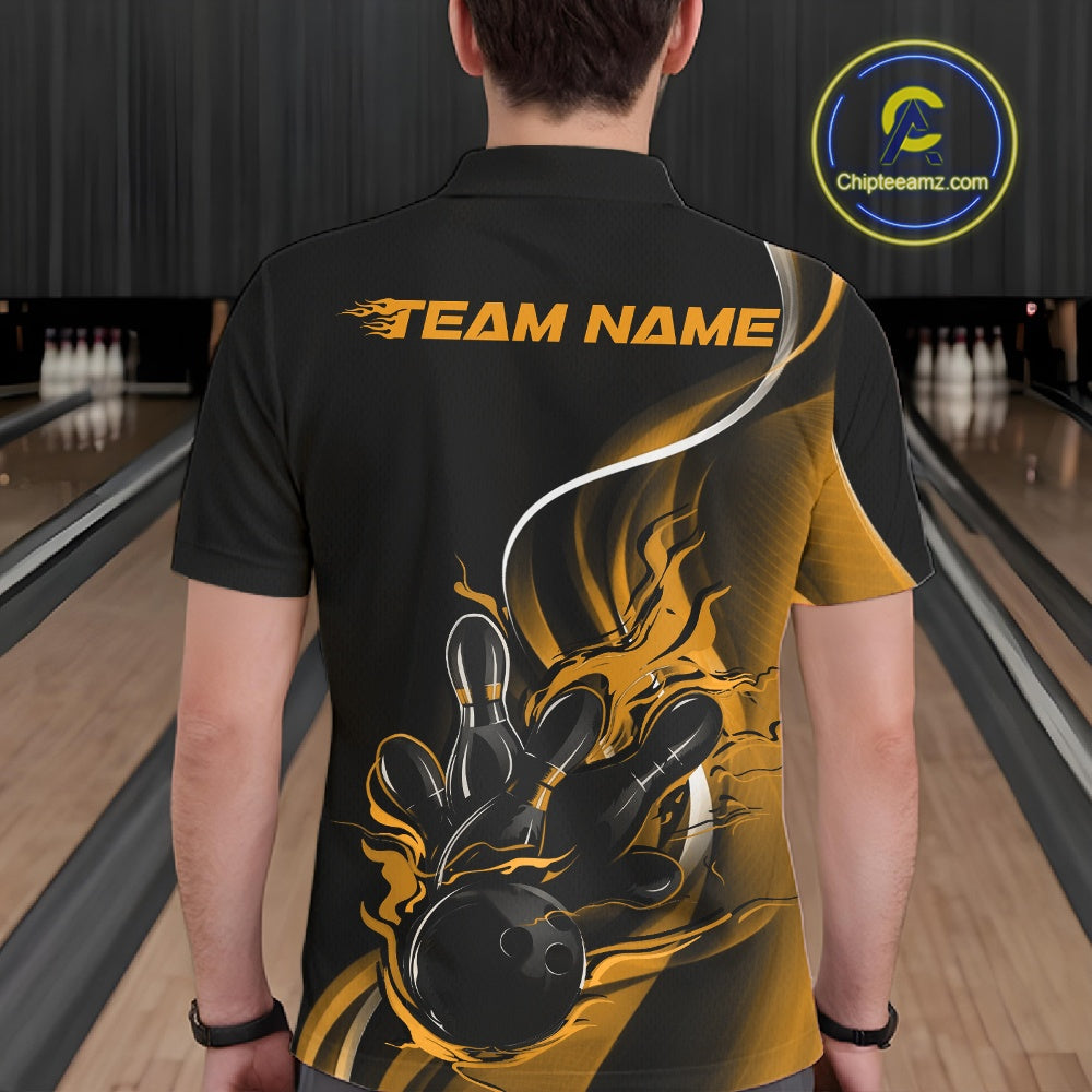 Male model seen from the back in a bowling lane wearing a black and yellow polo shirt featuring a flame bowling ball striking pins in a powerful motion design.