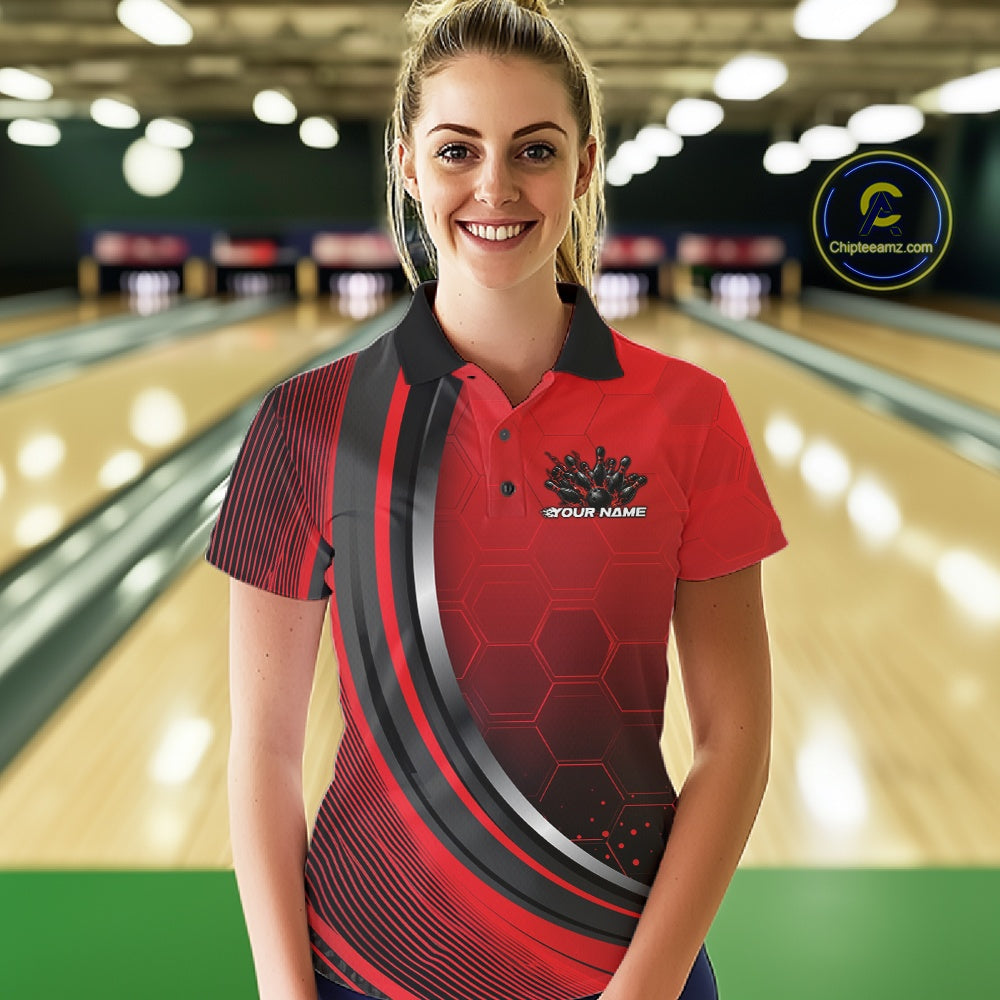 Female model in a bowling alley wearing a black and red polo shirt with honeycomb texture and a dynamic flame bowling strike graphic.
