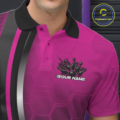 Close-up of the left chest area of a black and pink bowling polo shirt, featuring honeycomb pattern with a flaming bowling ball hitting pins.