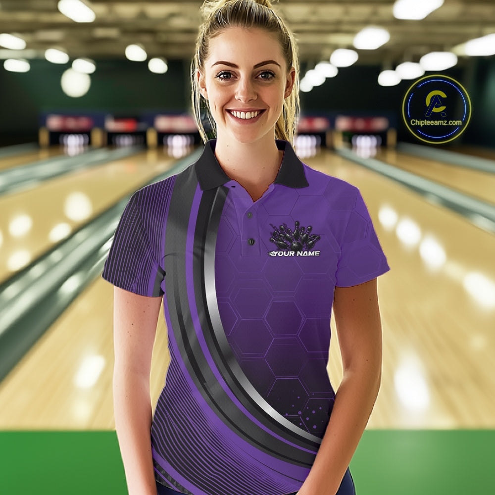 Female model in a bowling alley wearing a black and purple polo shirt with honeycomb accents and a dynamic flame bowling strike illustration.