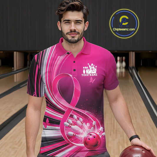 Male model wearing a pink bowling polo with breast cancer awareness ribbons and bowling graphics, front view at the bowling lane