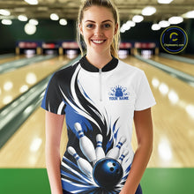 Load image into Gallery viewer, Female model wearing a white, black, and blue bowling quarter zip shirt featuring a flaming bowling ball hitting the pins, shown from the front in a bowling lane.