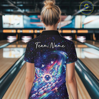 Back view of a female model in a bowling venue wearing a colorful bowling quarter-zip shirt with luminous butterfly wings and galaxy graphics.
